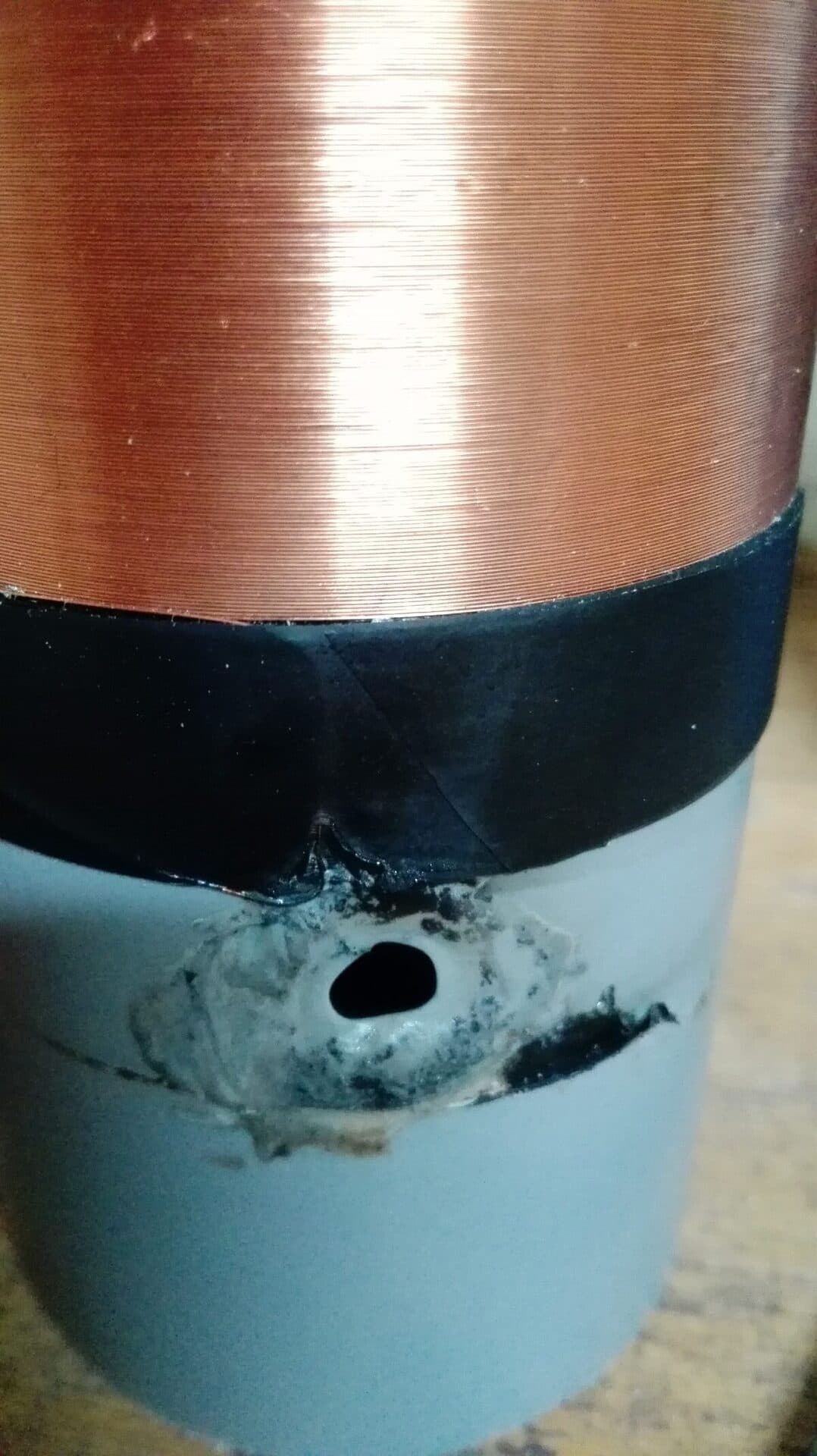 A scorch mark where a 230 V arc reached the core